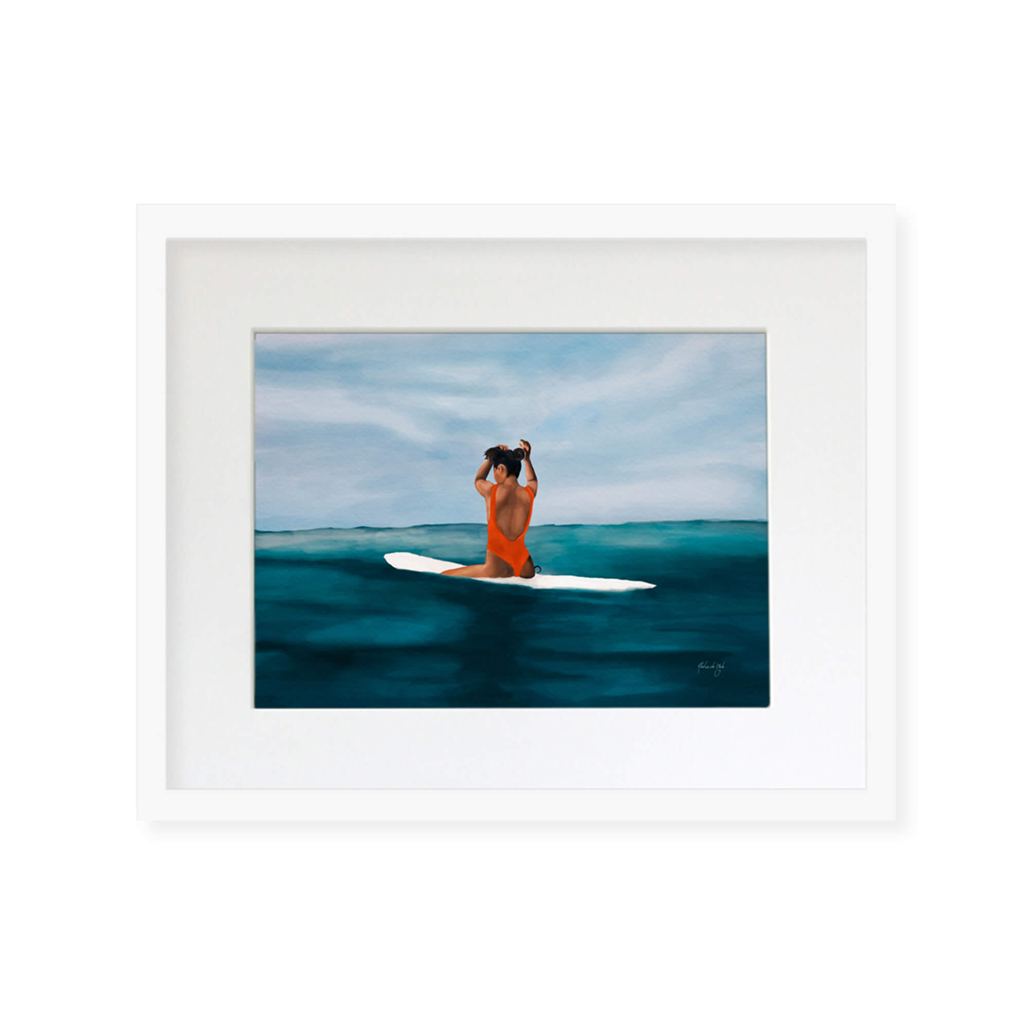 A framed matted art print of a woman peacefully surfing by Hawaii artist Aloha De Mele