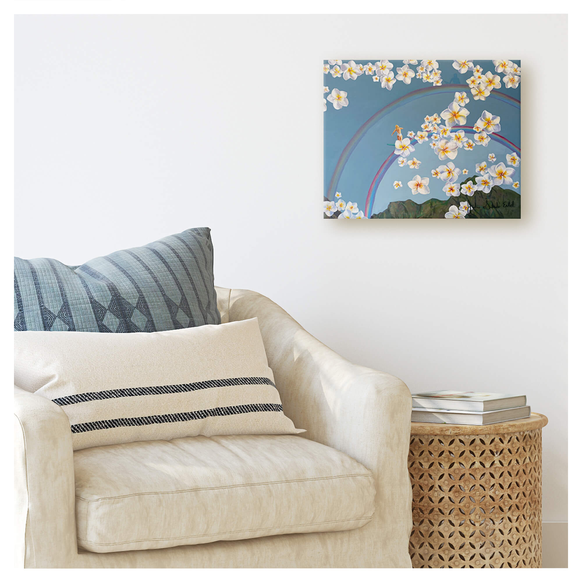 A canvas giclée print featuring a woman surfing on a rainbow above the mountains of Hawaii framed by plumeria flowers by Hawaii artist Jackie Eitel
