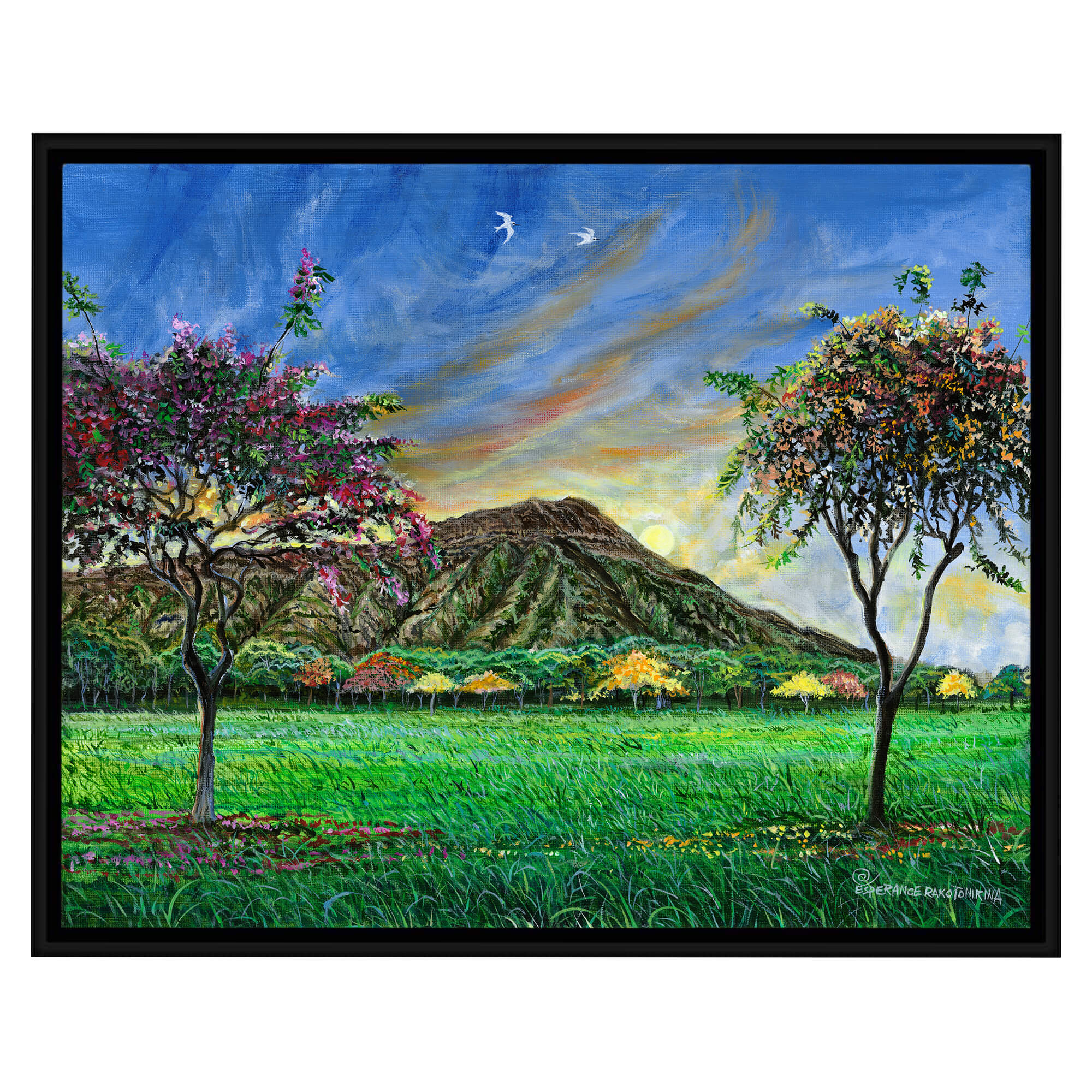 A canvas art print with black frame  showcasing a Peaceful mountain landscape with trees by hawaii artist Esperance Rakotonirina