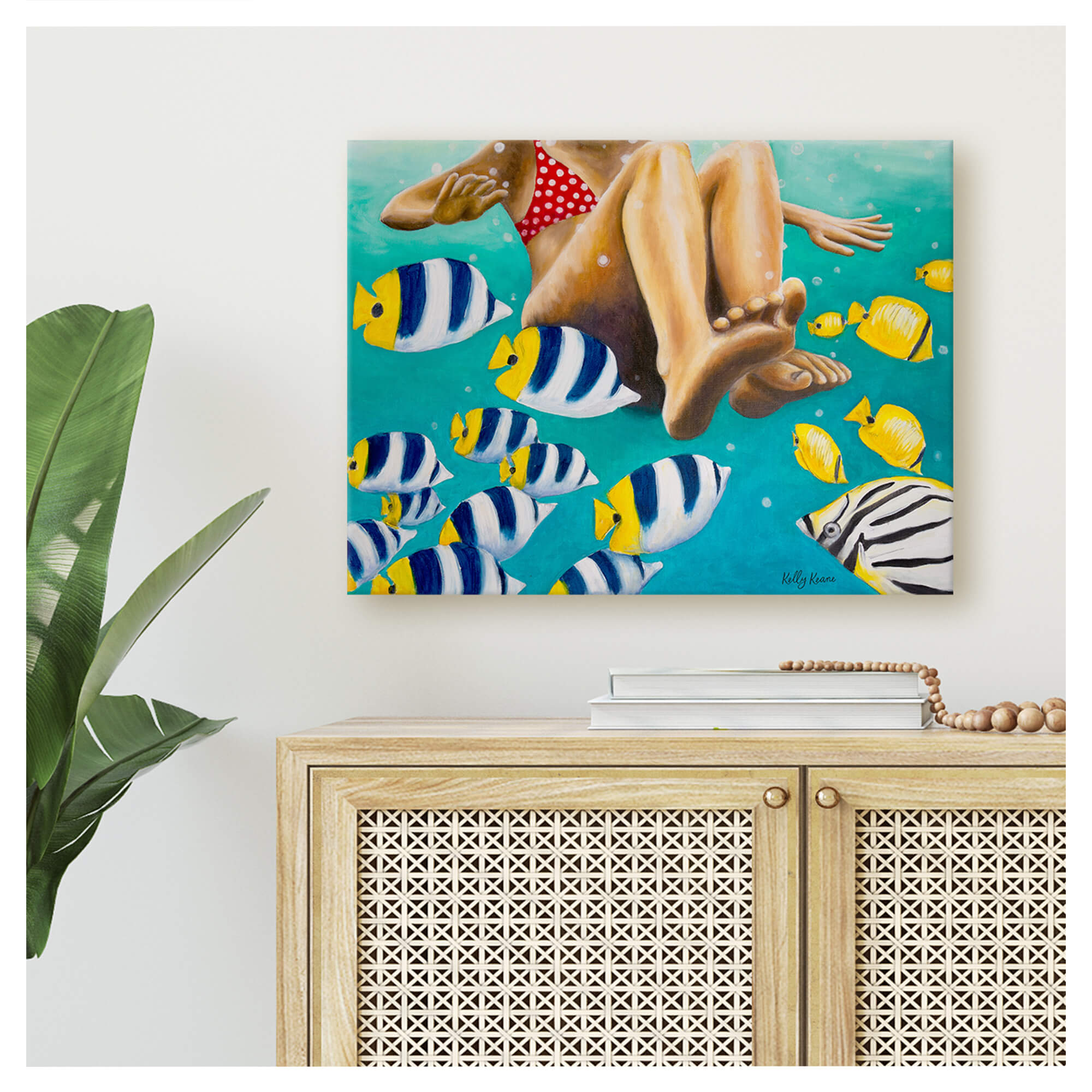 Canvas art print featuring a girl swimming with fishes by hawaii artist Kelly Keane