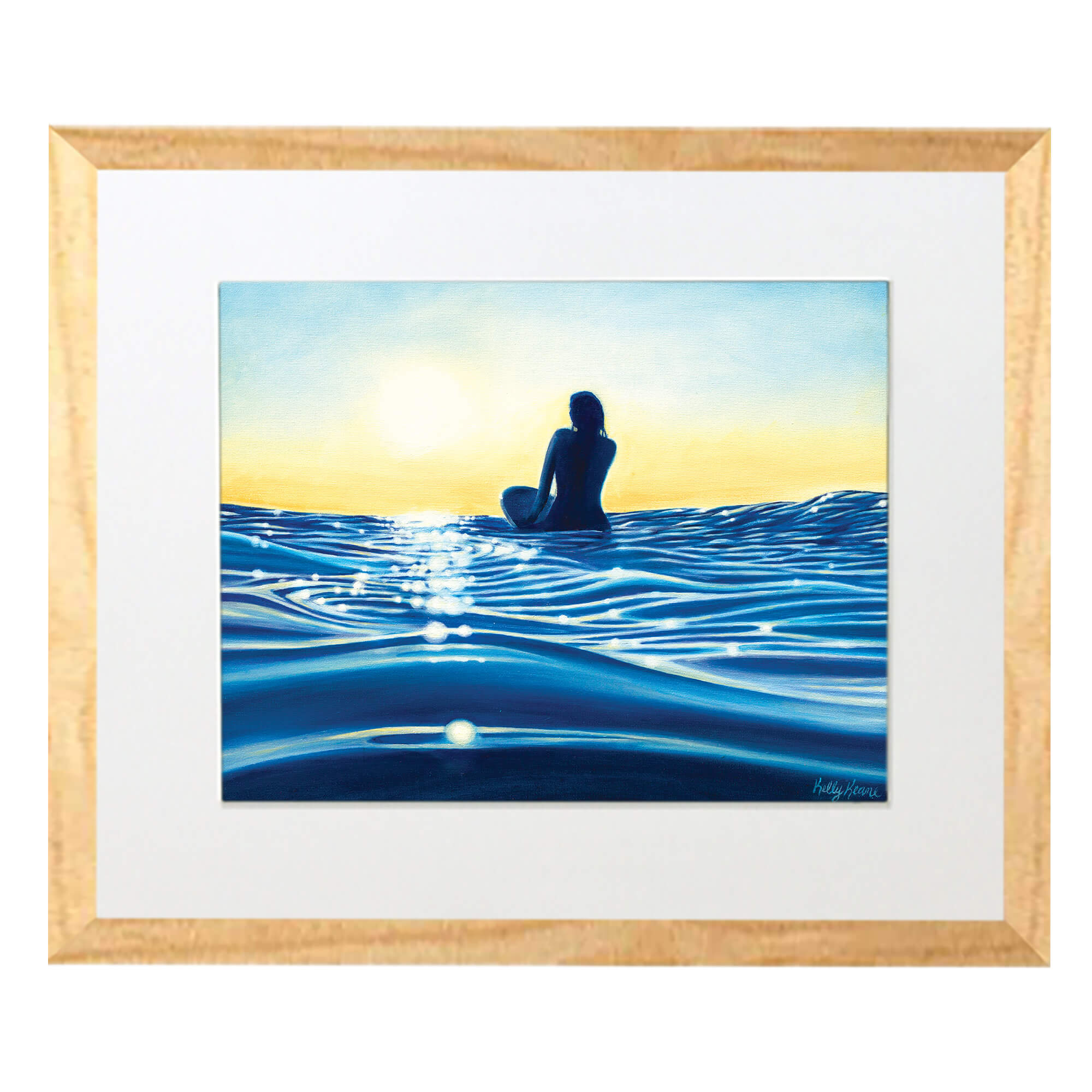 Matted art print with  wood frame depicting a woman sitting on a surf board while watching the sunset by hawaii artist Kelly Keane 