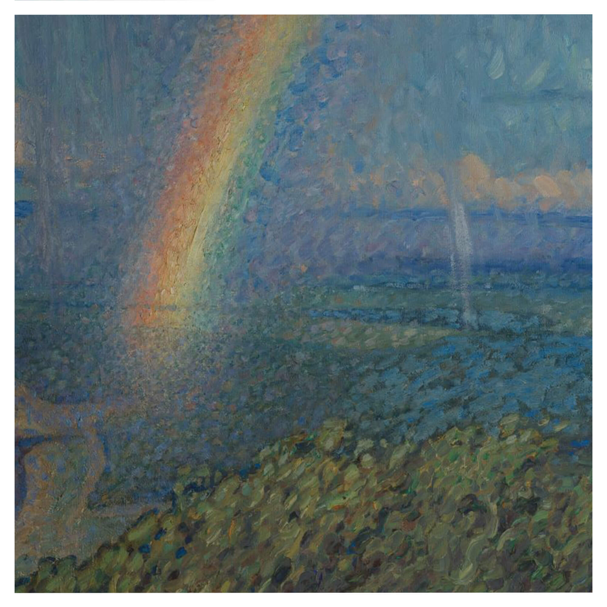 A rainbow in a landscape with distant ocean view