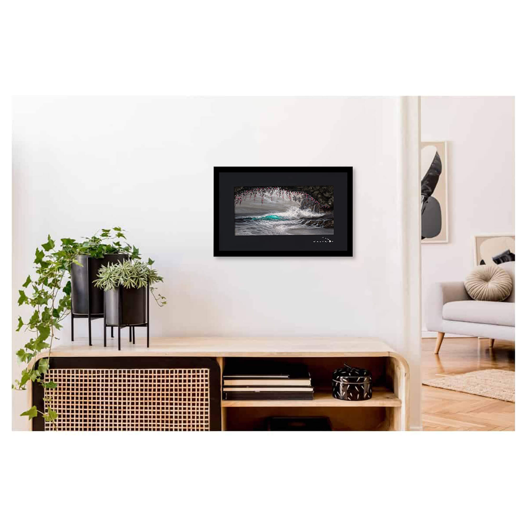 Framed matted art print of a black and white, with a touch of pink and teal, wave as seen from a cove by Hawaii artist Walfrido Garcia
