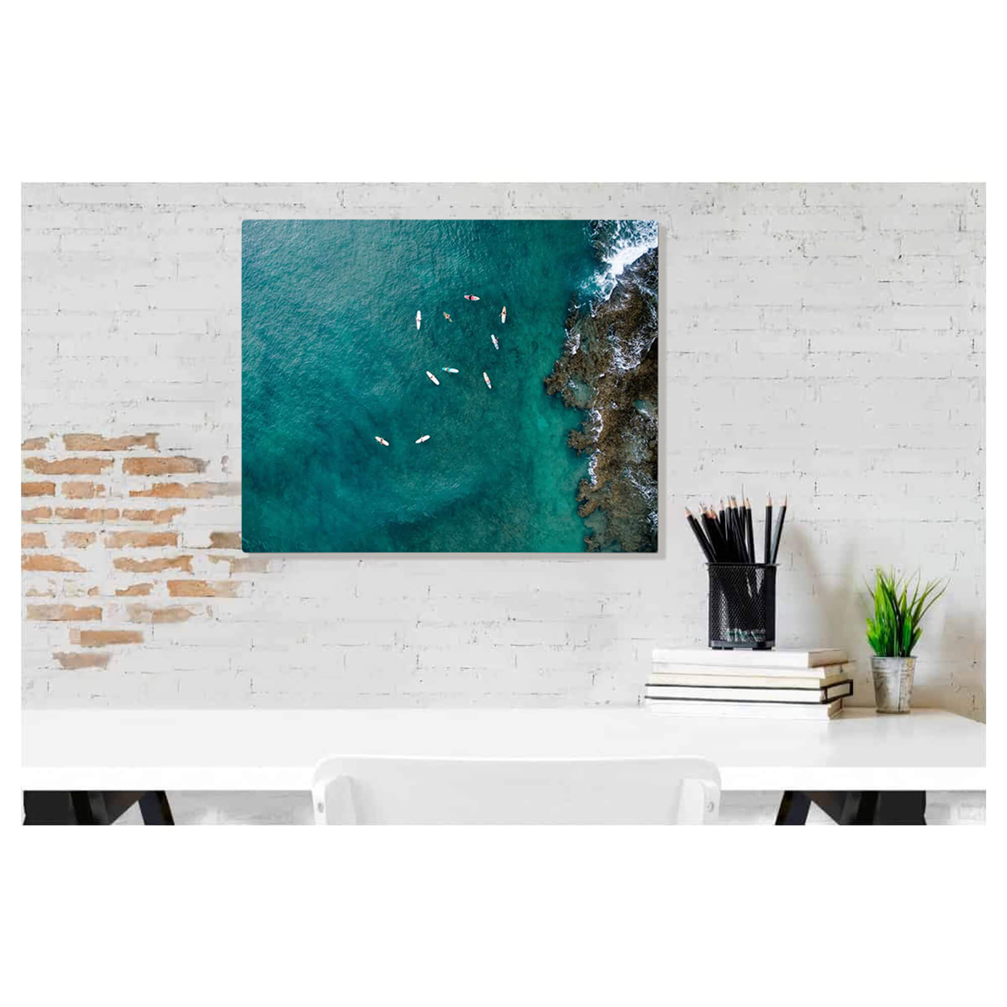 A metal art print of a drone photo of surfers near Turtle Bay on the North Shore of Oahu by Hawaii artist Bree Poort