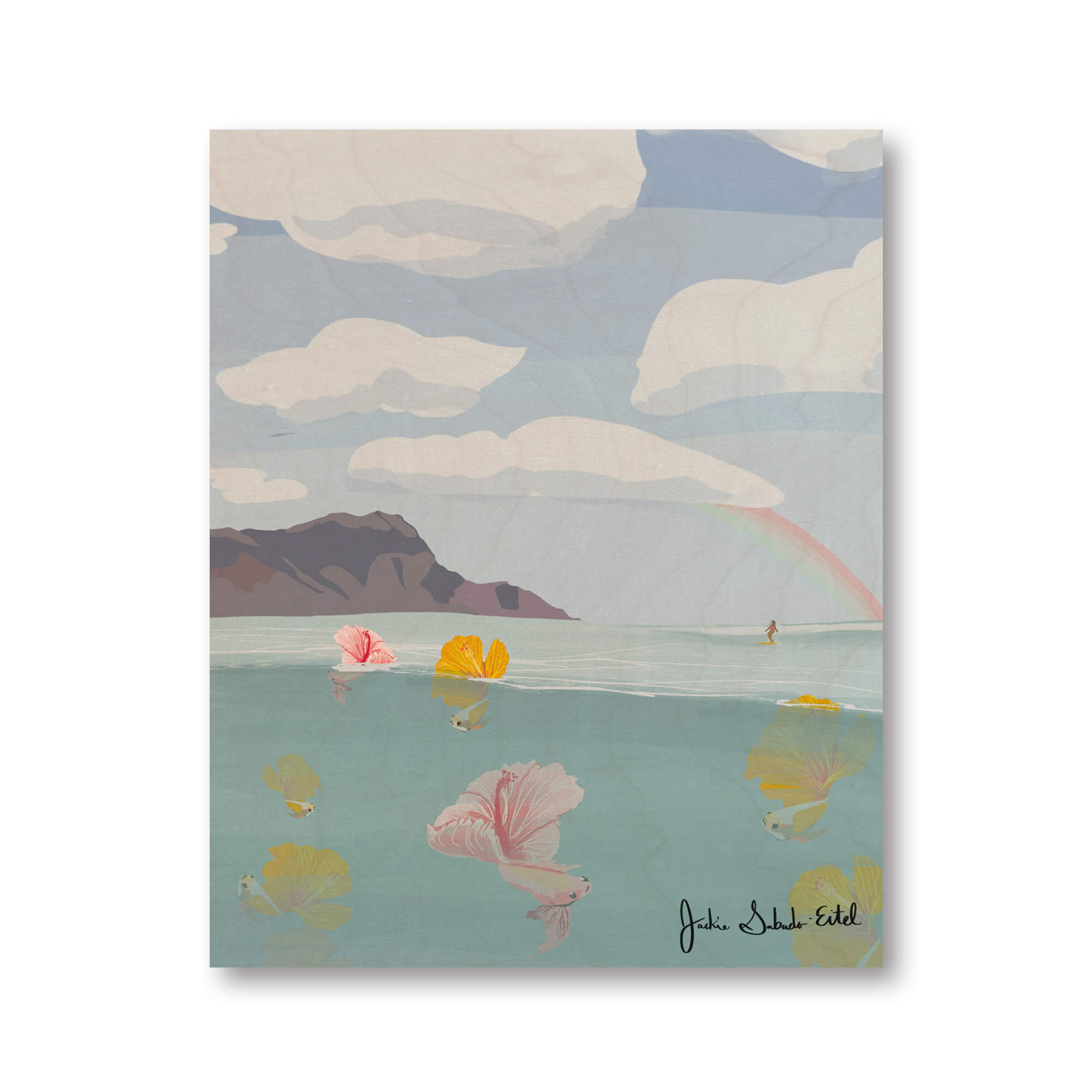 A wood print of colorful tropical fish with hibiscus flowers as their tails, the Diamond Head in the background with a woman surfing by Hawaii artist Jackie Eitel