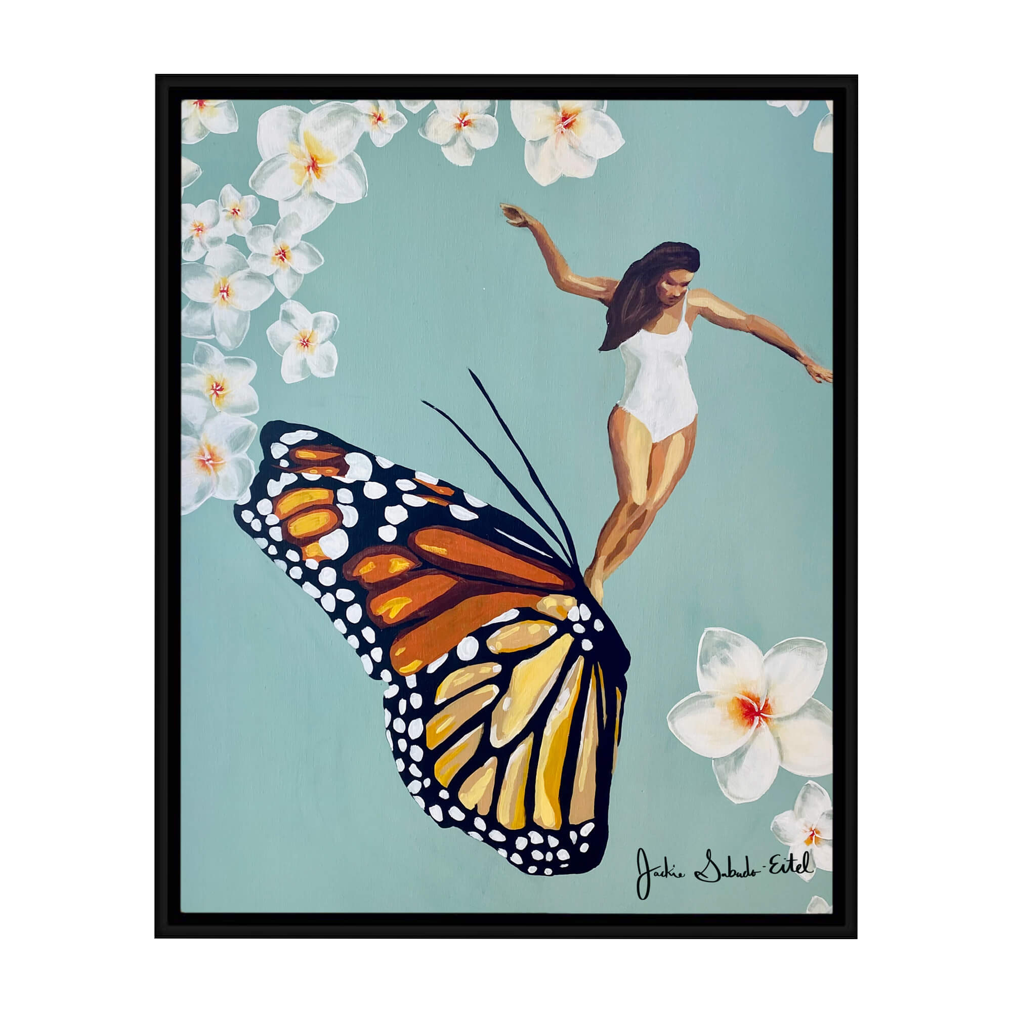 A framed canvas giclée print featuring a woman riding a butterfly framed by plumeria flowers on a pastel teal-hued background by Hawaii artist Jackie Eitel