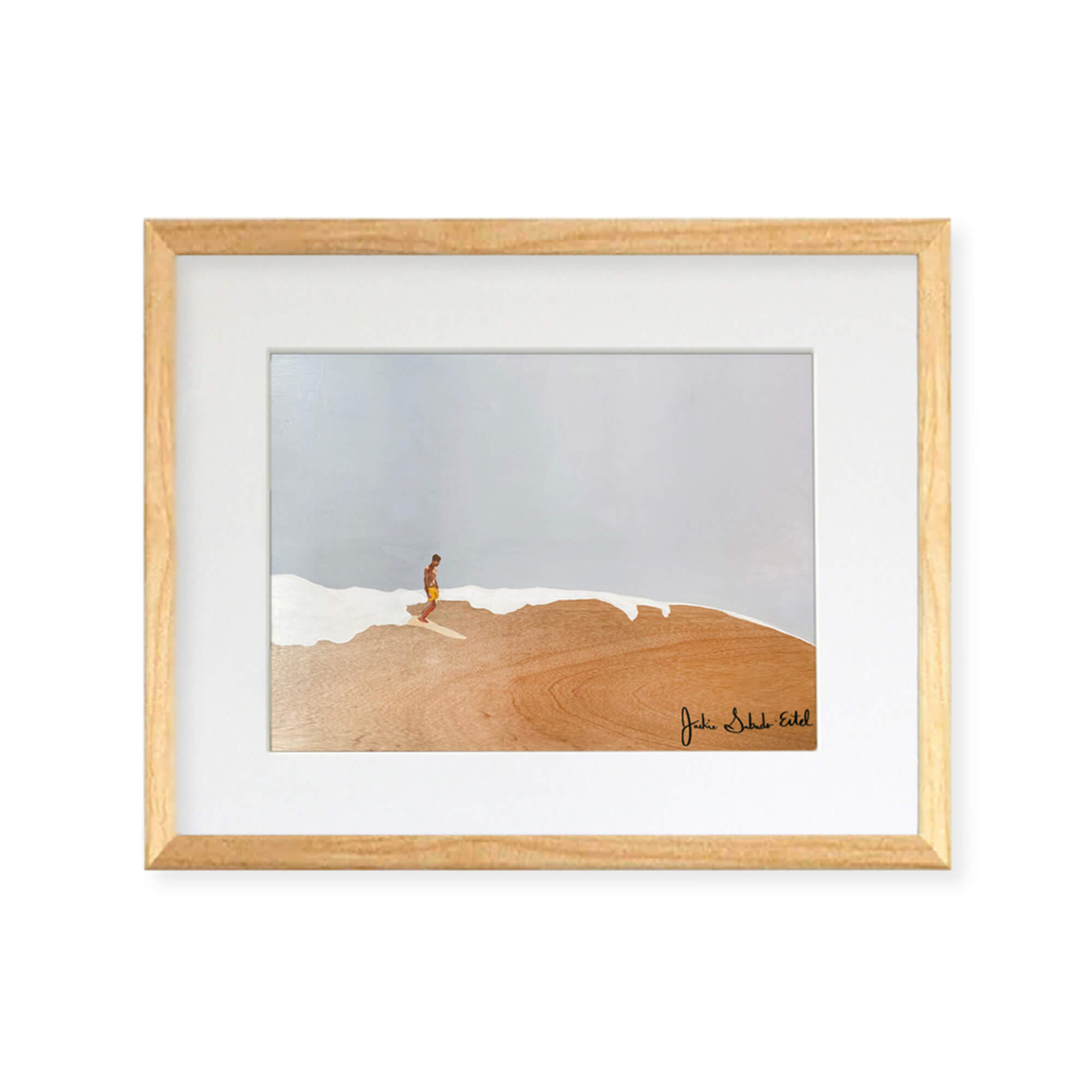A framed matted art print featuring a man peacefully riding the epic waves of Hawaii by Hawaii artist Jackie Eitel