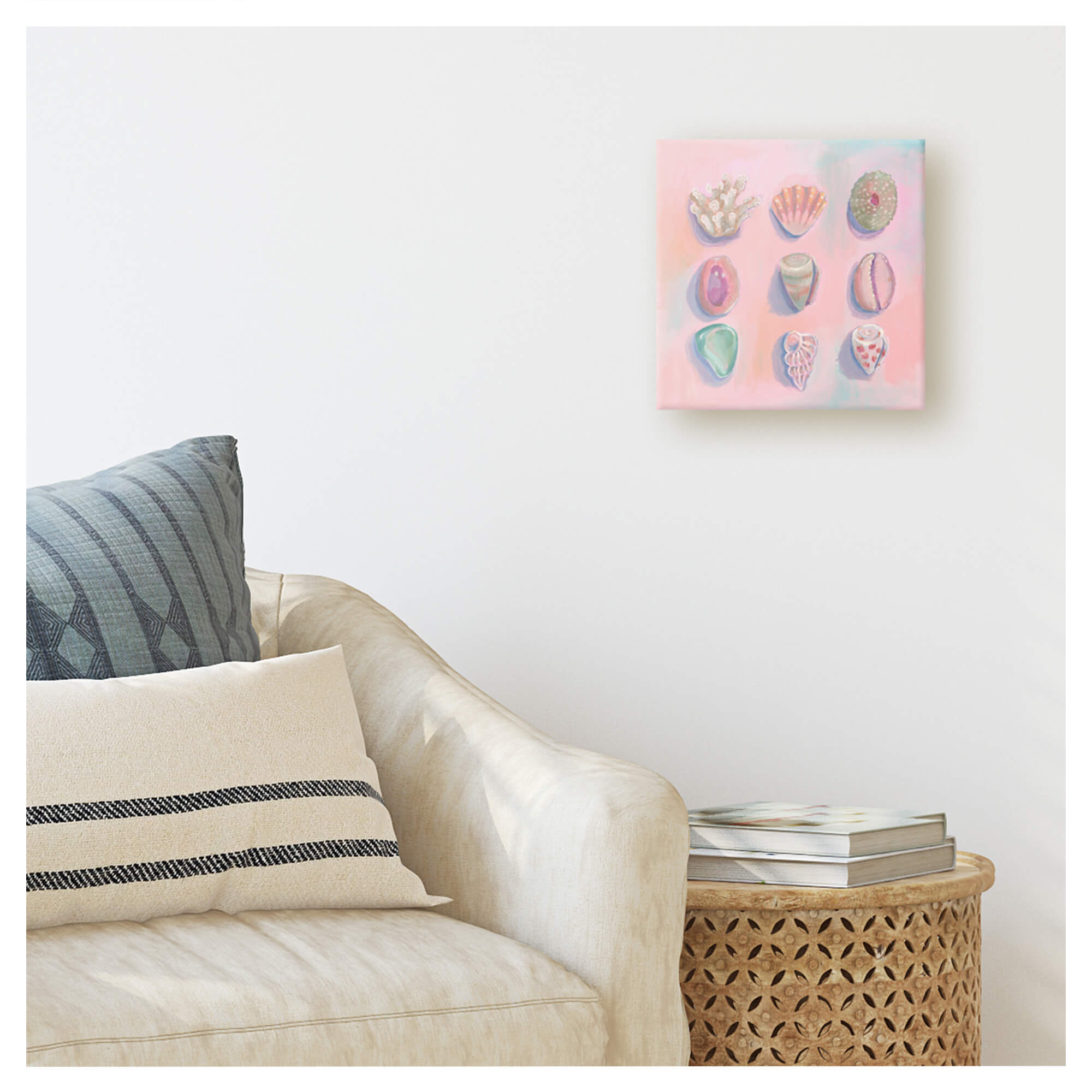 A painting on canvas depicting seashells with light pink background by Hawaii artist Lindsay Wilkins
